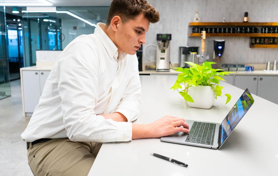 Man taking part in a meeting on a laptop